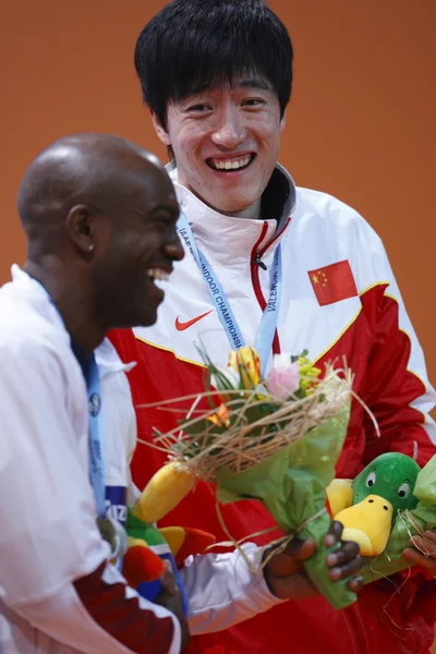 Allen Johnson with silver medal and Xiang Liu with gold medal in Men\'s 60 metres hurdles