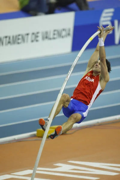 Evgeniy Lukyanenko competes in Men's pole vault