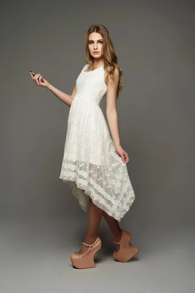 Young girl in unusual lace dress
