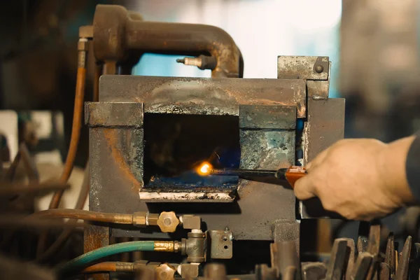 Blacksmith turn on the furnace.