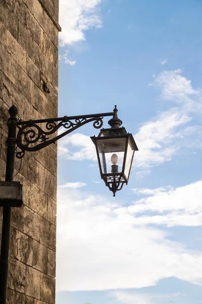 Vintage street lamp in wrought iron.