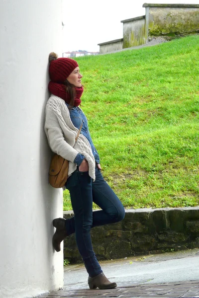 Young woman relaxing on Hondarribia old village streets during a winter morning walk, Basque Country, Spain