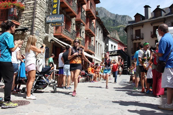 Benasque, Spain - July 26th of 2015: Trail runners pushing hard on their final rush to reach the finish line during one of the five races of the Gran Trail Aneto Posets (GTAP) of 2015.