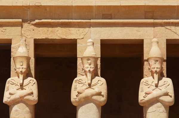 Statues surrounding the main entrance of Temple of Queen Hatshepsut built between 1508 and 1458 BC, midway between the Valley of Kings and the Valley of Queens, Luxor (Ancient Thebes), Egypt.
