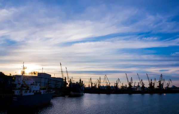 Cargo port on the background of the sunset sky