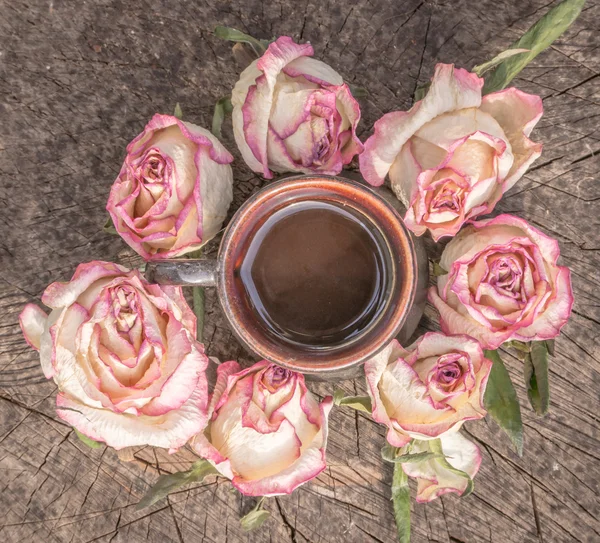 Coffee and dried roses
