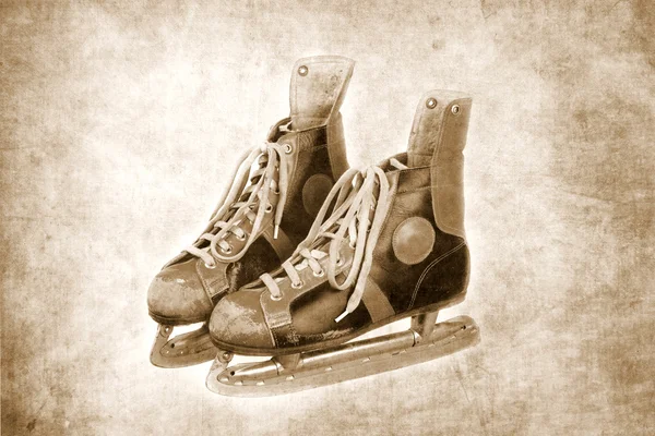 Used old ice skates, textured background, retro, vintage, black and white