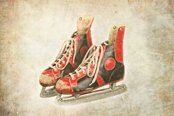 Red and black colors ice skates, textured background, retro, vintage,