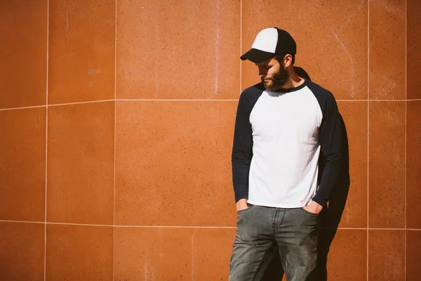 White blank t-shirt with space for your logo on a hipster man wi