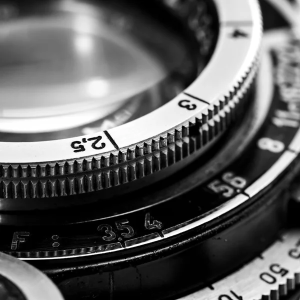 vintage movie camera lies against the background of reels with developed  film of lenses. Cover. - Stock Image - Everypixel