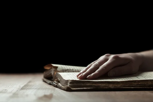 Woman hands reading the bible