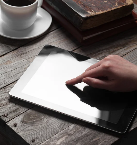 Woman hand presses on screen