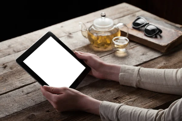 Woman shows screen of digital tablet