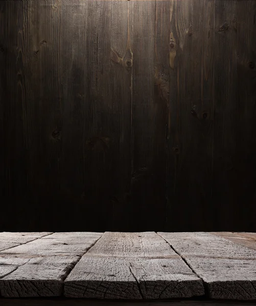 Dark wooden background texture. Wood shelf, grunge industrial interior with light bulb