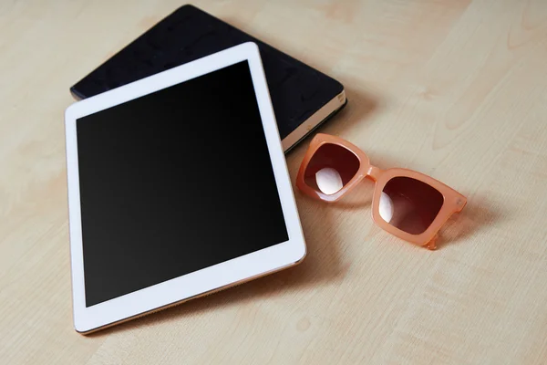 Mobile tablet with notebook and glasses