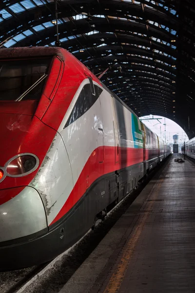 Red Train in Milan Central Railway Station, Italy