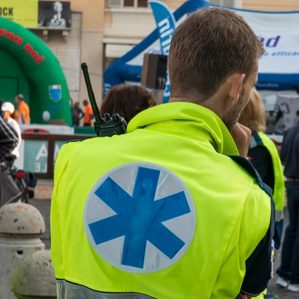 Paramedic with radio equipment wait for call