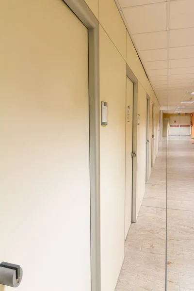 Beige hospital hallway, empty hospital corridor, hospital