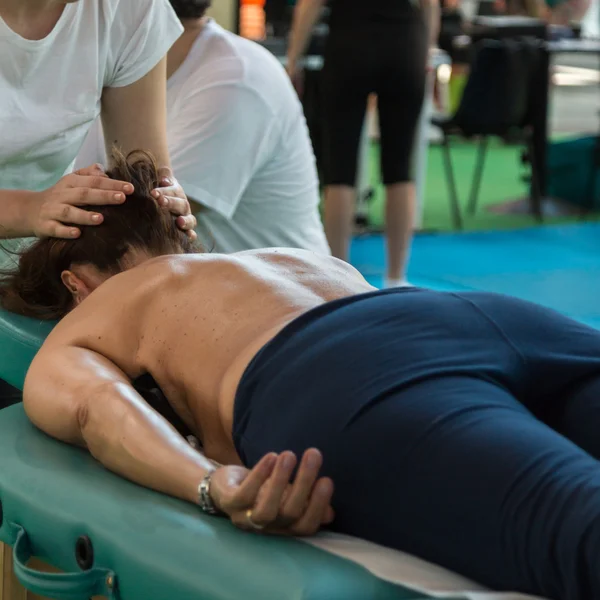 Woman lying on Therapist\'s Table after Fitness Activity