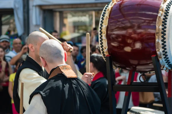 Two Japanese Taiko Drummers during Traditional Show