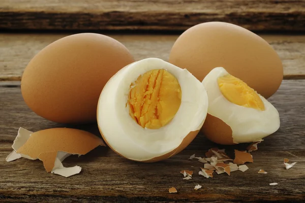 Egg boiled on old wooden background