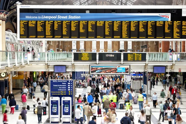 London, United Kingdom, Liverpool Street Station, 23 July 2011 : Commuters gathered in front of train time announcement board during rush hour at London Liverpool Street Station