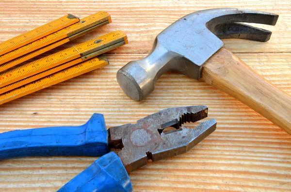 Claw hammer, carpenter meter and pliers