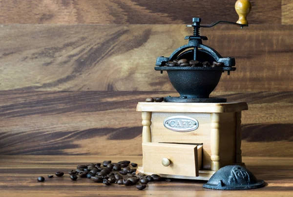 Coffee grinder with coffee beans, isolated