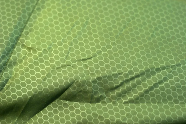 Texture background Green crumpled tissue in cell