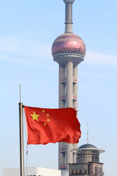 Five-star Red Flag (national flag of China) and Oriental pearl tower in Shanghai