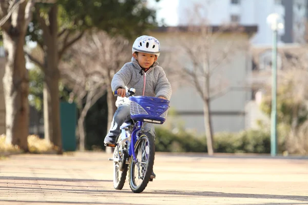 Japanese boy riding on the bicycle (6 years old)