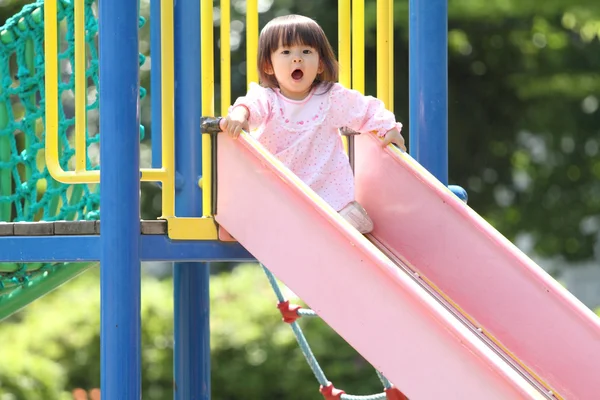 Japanese girl on the slide (1 year old)