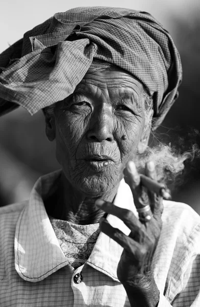 Old woman smoking a in Myanmar (Burma)