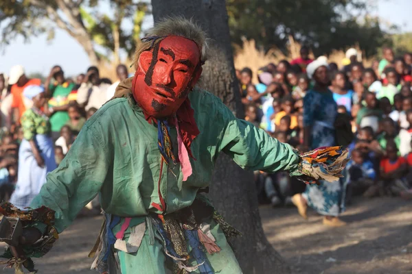 Traditional Nyau dancer with face mask