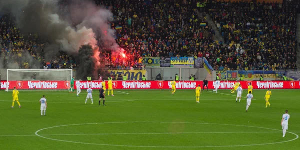 LVIV, UKRAINE - NOWEMBER 14: Terrorists fans disrupted  football match Ukraine Slovenia burning and explosion  fireworks packages. Bate on Nowember 14, 2015  Lviv, Ukraine