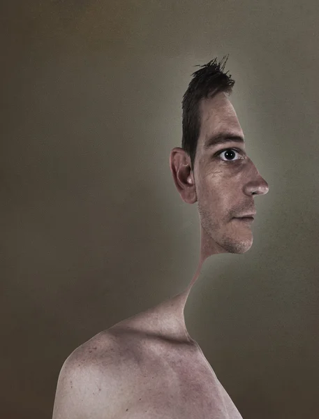 Surrealistic portrait of a young man with cut out profile