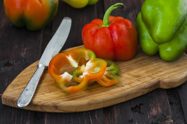 Bell peppers on wooden table