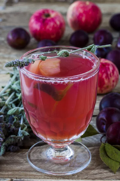 Sweet drink made from apples, plums and mint