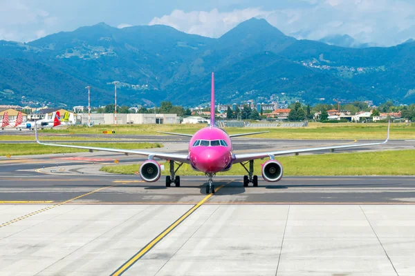 Aircraft Wizz Air aviation company at the airport of Bergamo.