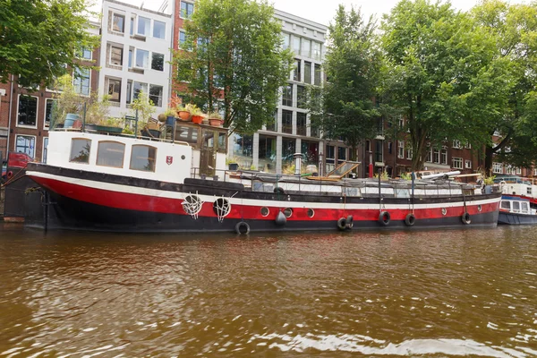 Traditional house boat on the canals of Amsterdam.