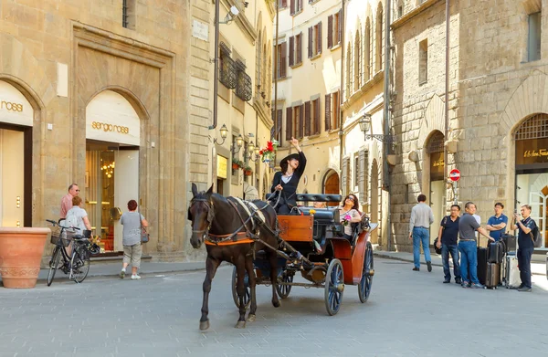 Florence. Walk in the horse-drawn carriage through the city.