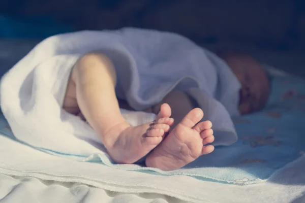 Newborn feet close up.
