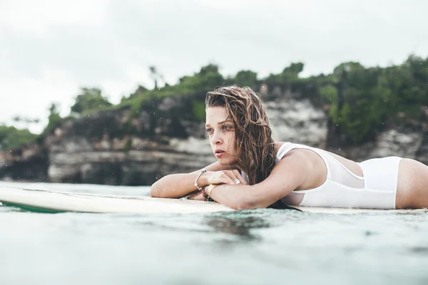 Beautiful woman  in the ocean surf