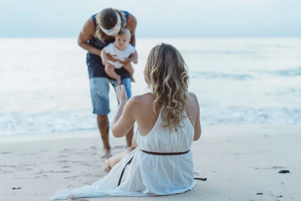 Beautiful young couple in love with a child