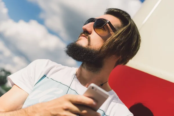 Modern young man with mobile phone