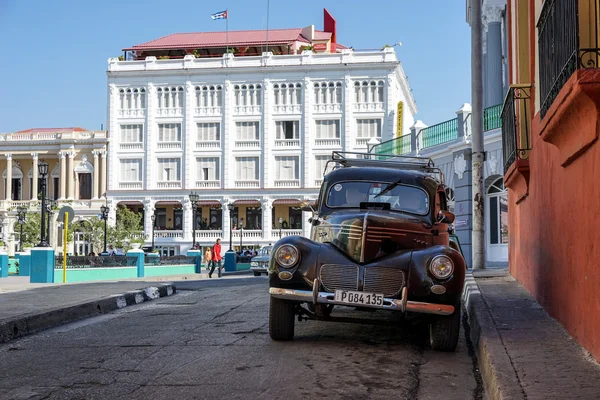 Town Square of Santiago De Cuba and old vintage amercan car