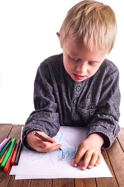Little boy draws a drawing