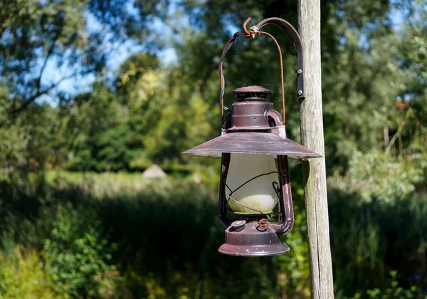 Vintage Kerosene lamp hanging outdoors