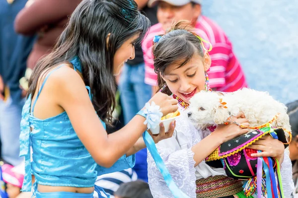 Two Youth Girls Feeding A Puppy