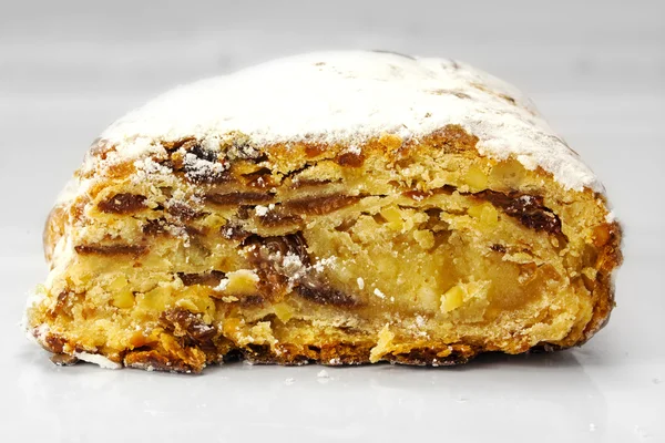 Christmas stollen, traditional German cake on a light gray backg